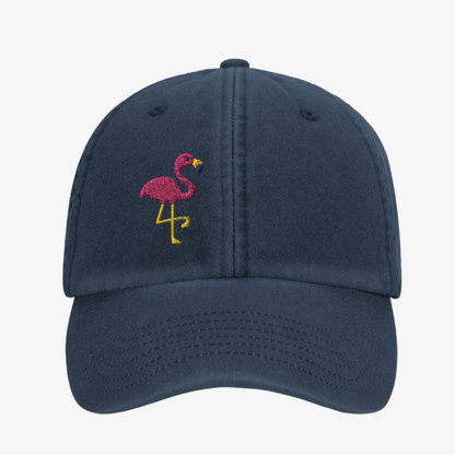 Navy blue cap with a pink flamingo design on a white background