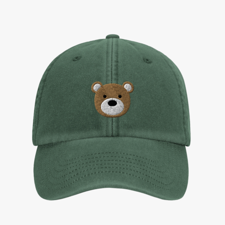 Green cap with a bear face embroidery on a white background