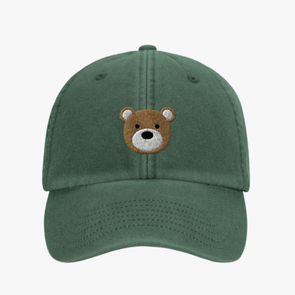 Green cap with a bear face embroidery on a white background
