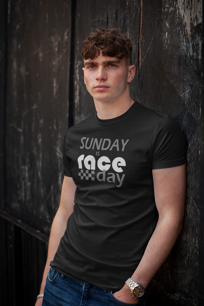 Man wearing a black t-shirt with 'Sunday is race day' text against a dark background